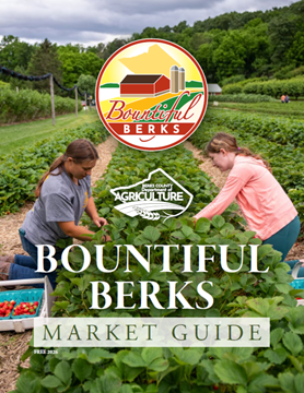 picture of cover of Bountiful Berks Guide - two women picking strawberries with logos